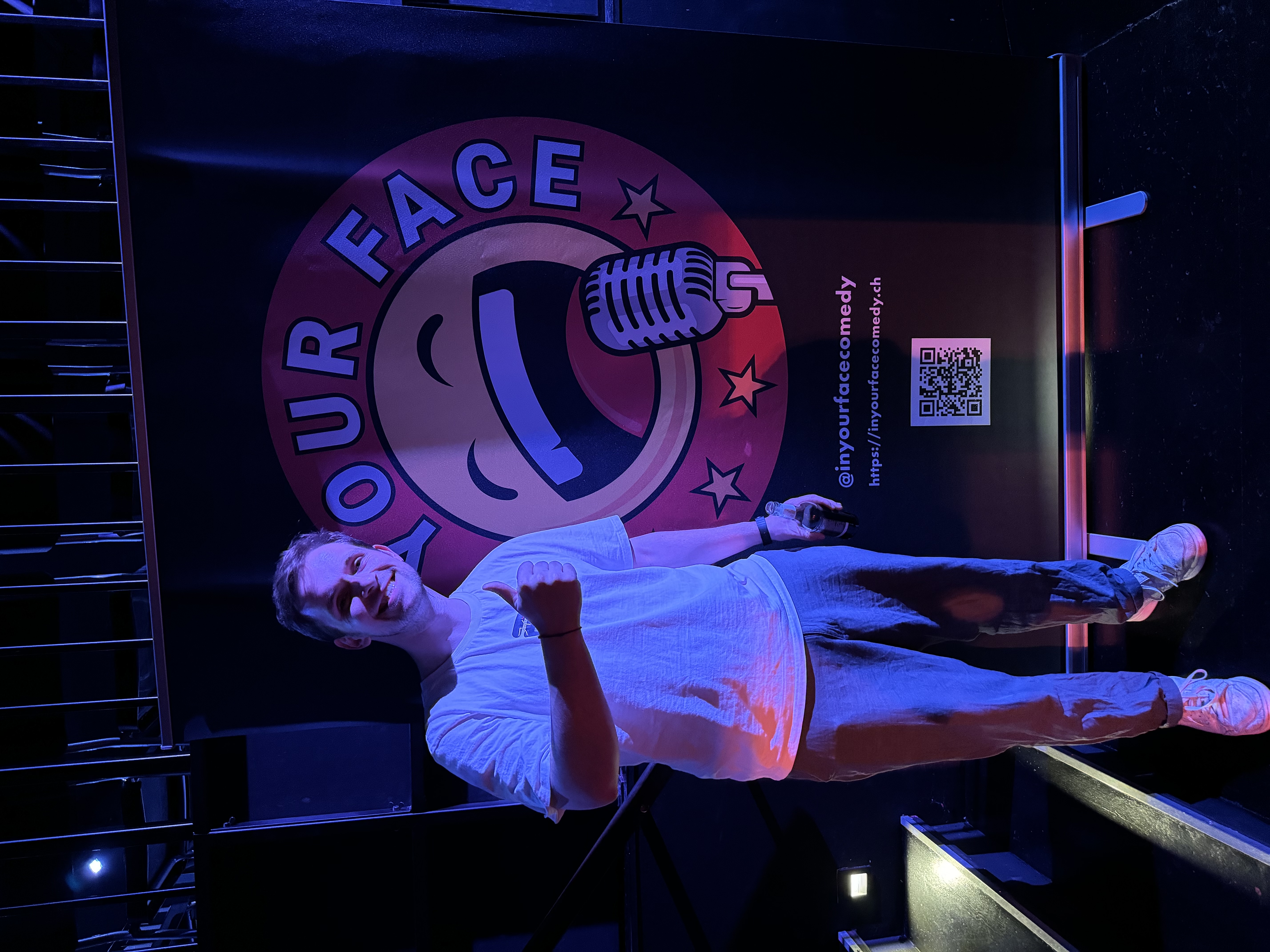IN YOUR FACE Comedy, a comedian performing stand-up on stage in Zürich (2024)