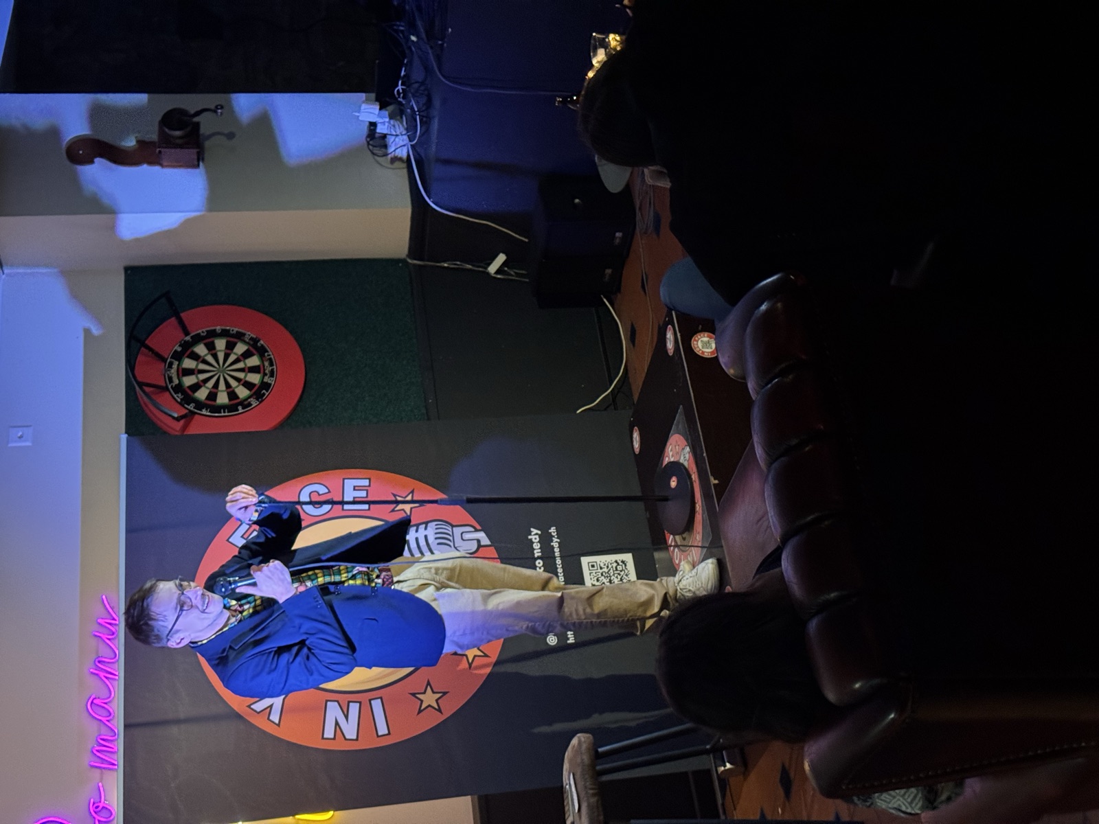 Woocash performing stand-up at IN YOUR FACE Comedy in Zürich