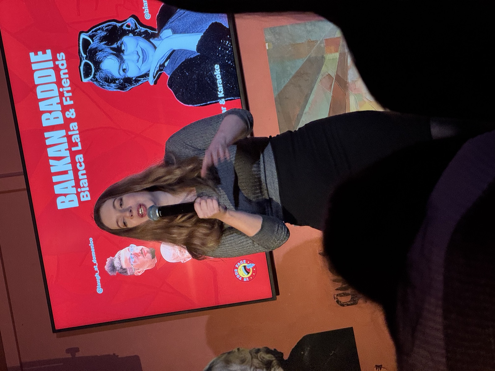 Martina performing stand-up at IN YOUR FACE Comedy in Zürich