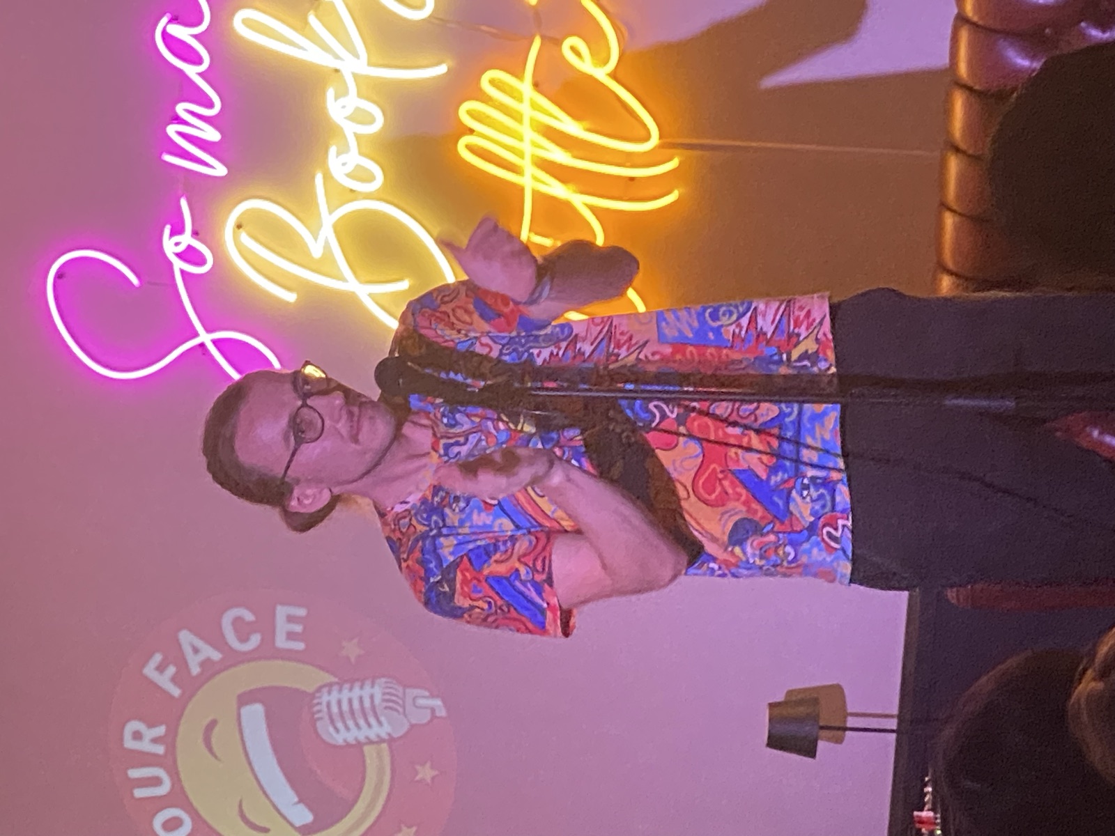 Woocash performing stand-up at IN YOUR FACE Comedy in Zürich