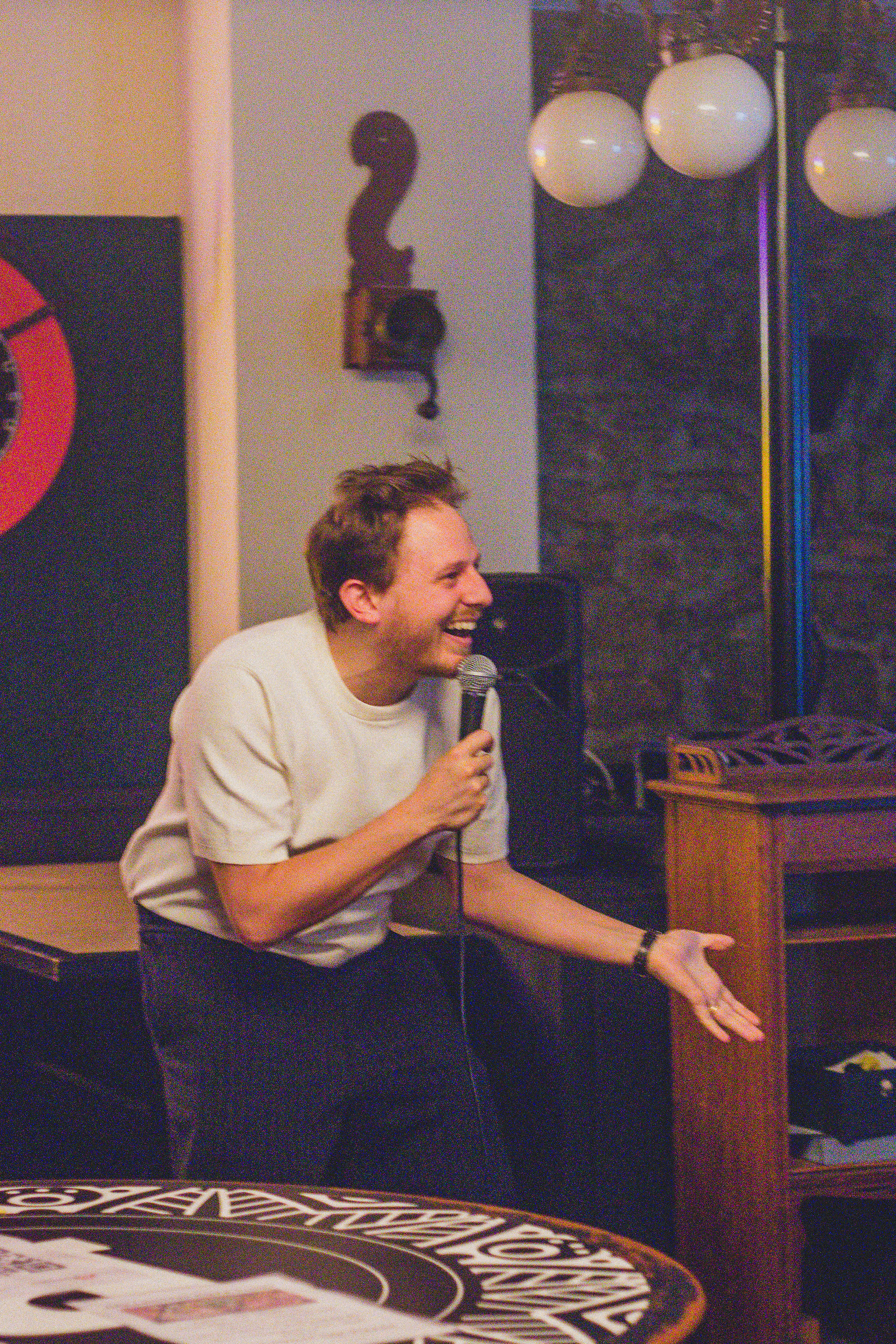 Adonis performing stand-up at IN YOUR FACE Comedy in Zürich