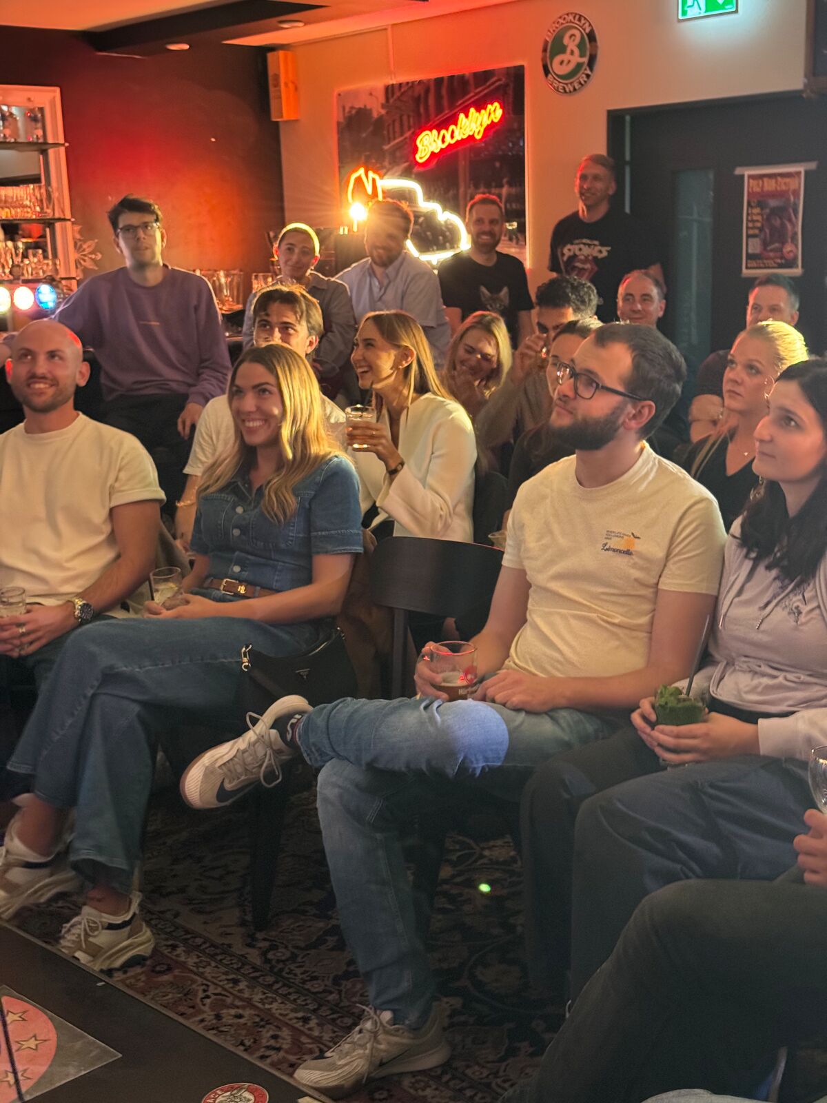 IN YOUR FACE Comedy, a packed audience laughing at a live English stand-up comedy show in Zürich (2026)