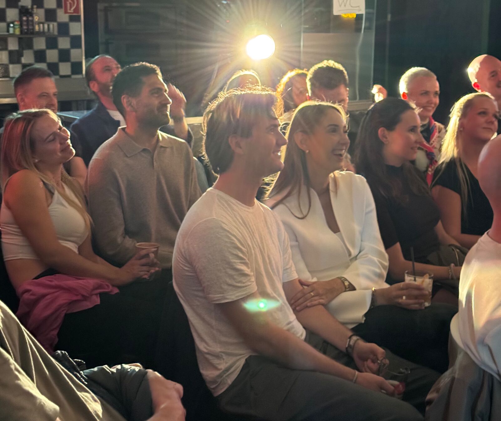 IN YOUR FACE Comedy, a packed audience laughing at a live English stand-up comedy show in Zürich (2026)