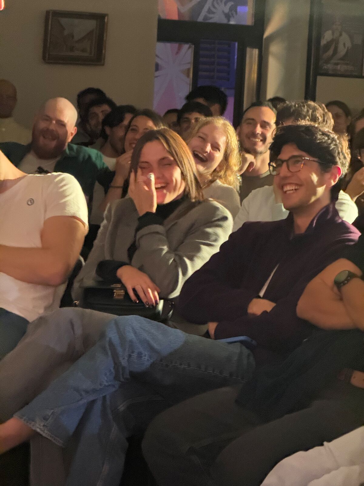 IN YOUR FACE Comedy, a packed audience laughing at a live English stand-up comedy show in Zürich (2026)