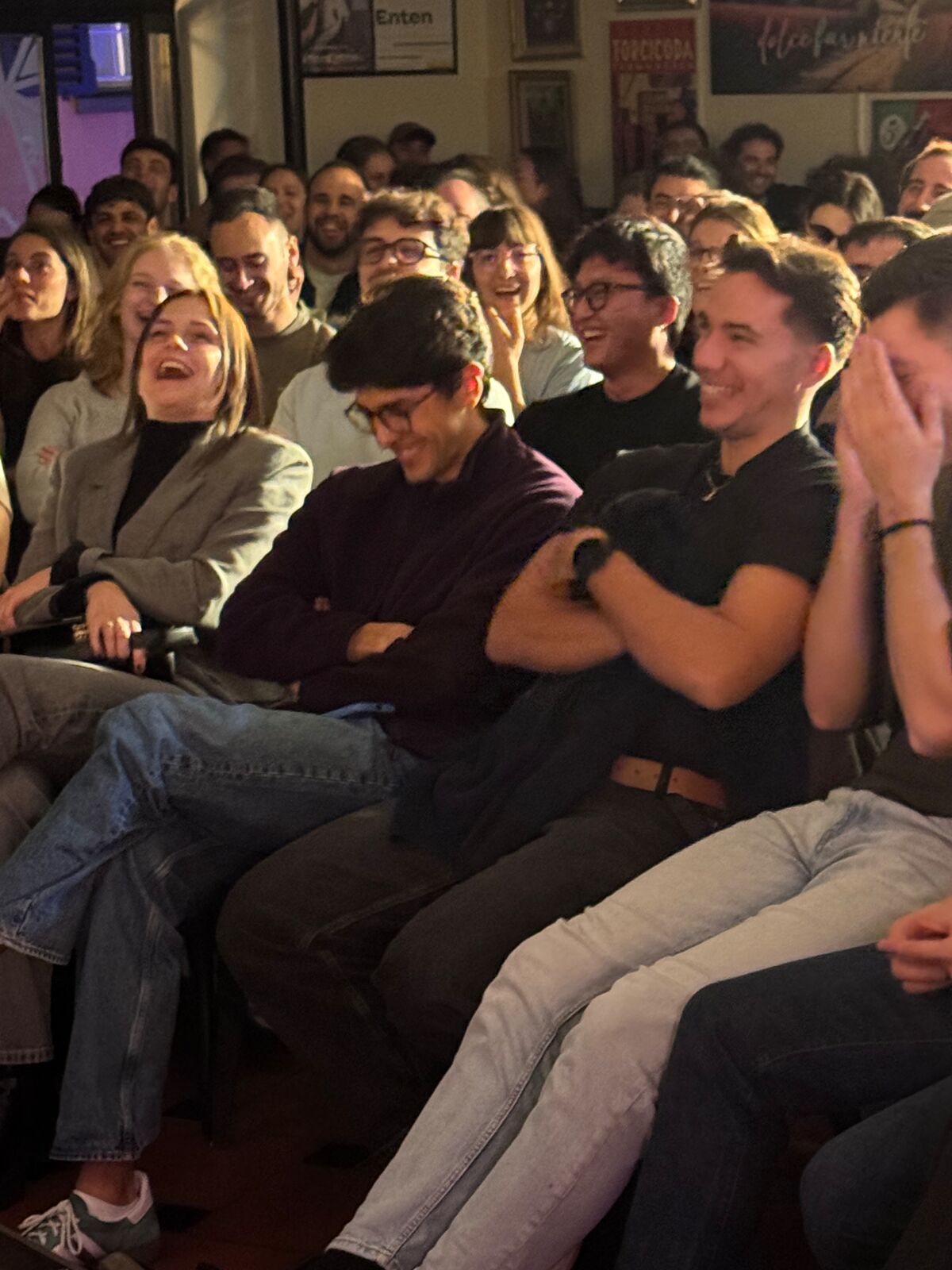 IN YOUR FACE Comedy, a packed audience laughing at a live English stand-up comedy show in Zürich (2026)