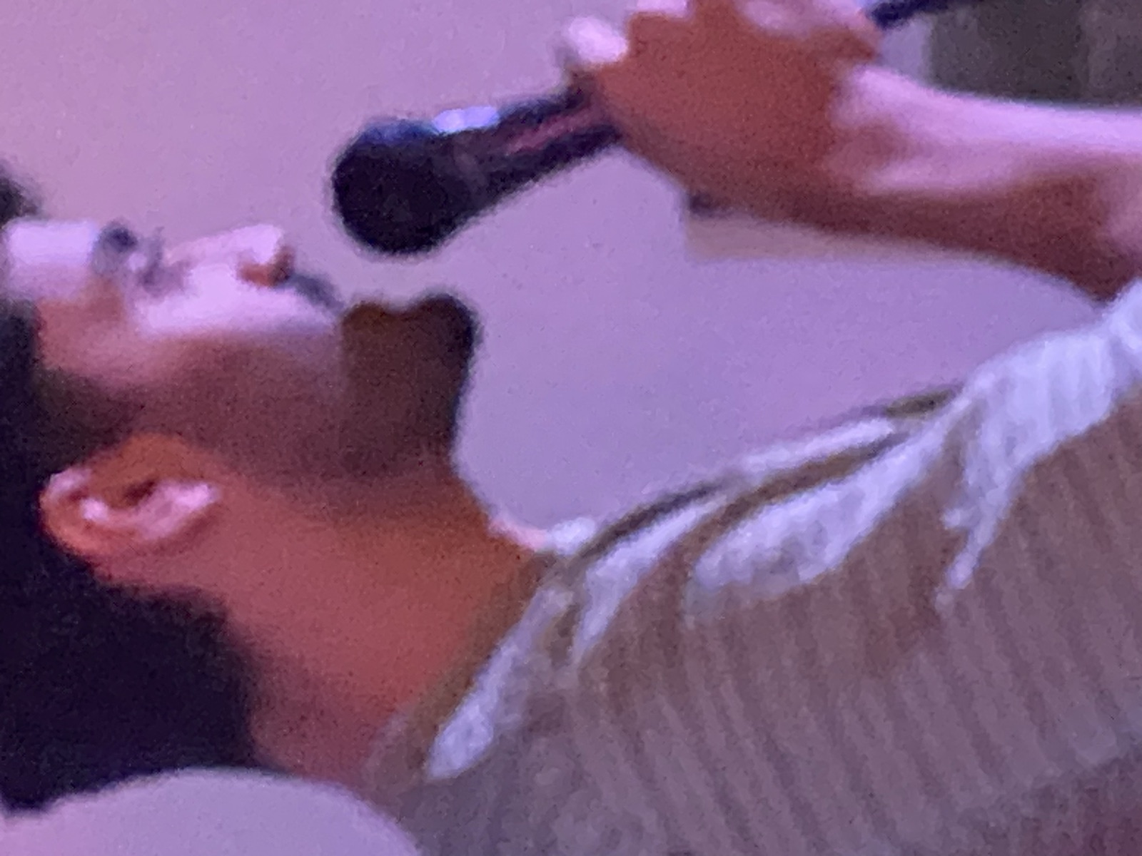 Pouya performing stand-up at IN YOUR FACE Comedy in Zürich