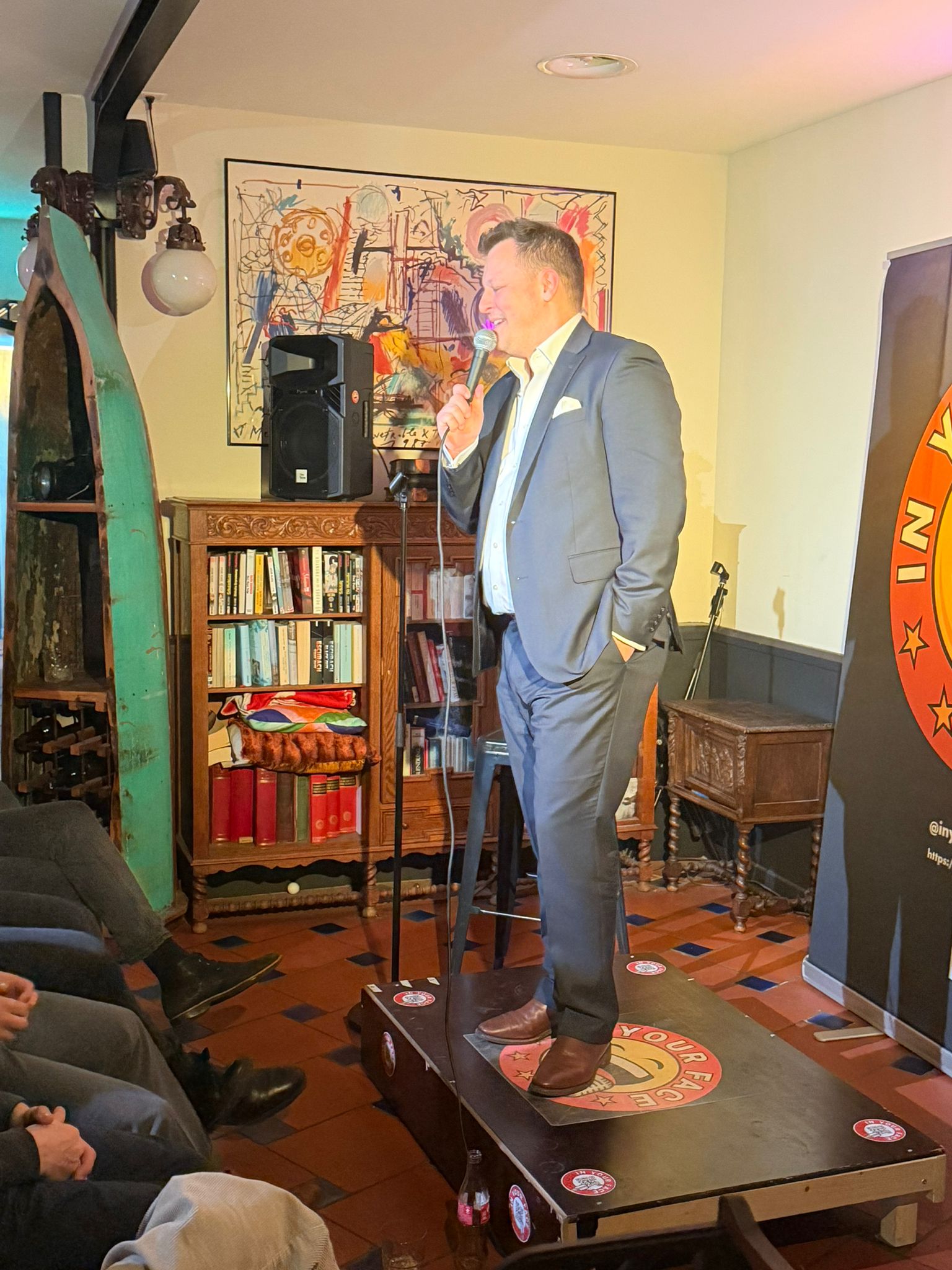 IN YOUR FACE Comedy, a comedian performing stand-up on stage in Zürich (2025)