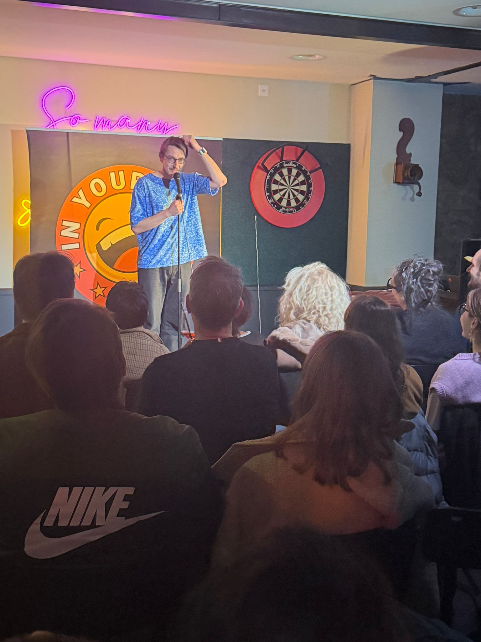 Woocash performing stand-up at IN YOUR FACE Comedy in Zürich
