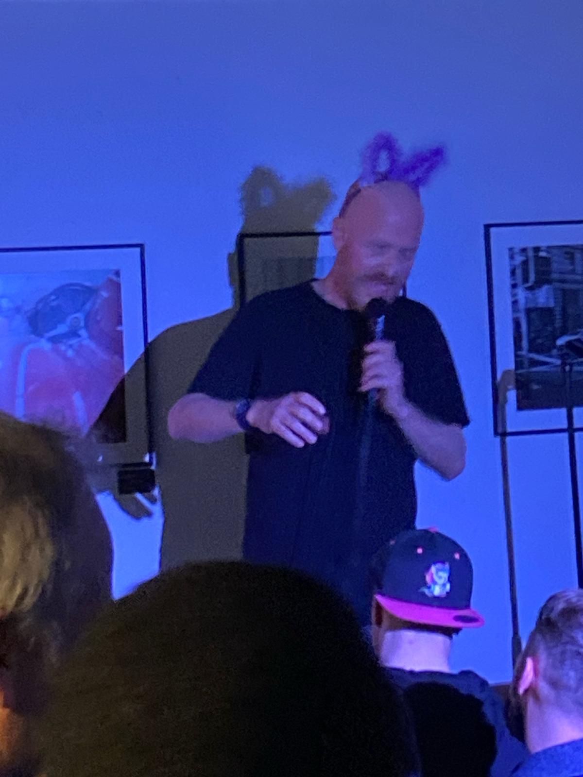 IN YOUR FACE Comedy, a comedian performing stand-up on stage in Zürich (2024)
